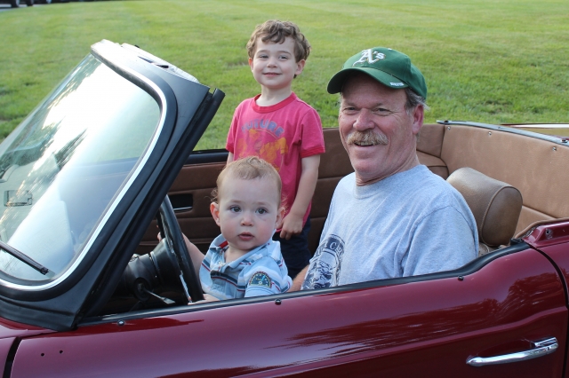 Jim with his two grandsons, Colin & Ian, in his old Triumph